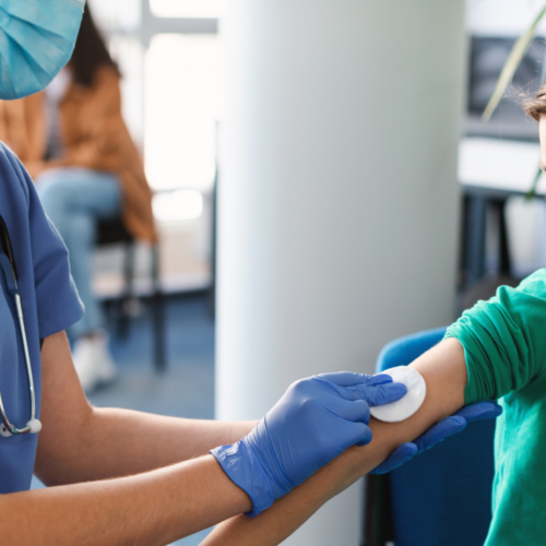 A preteen being administered the HPV vaccine.